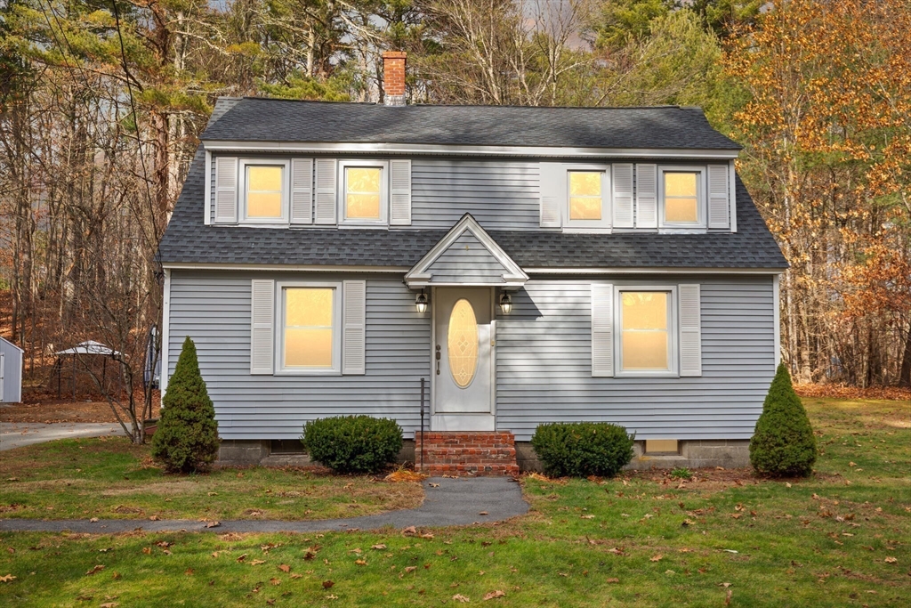 319 Pleasant Street Dunstable, MA 01827 - Photo 36 of 36 a front view of a house with a yard
