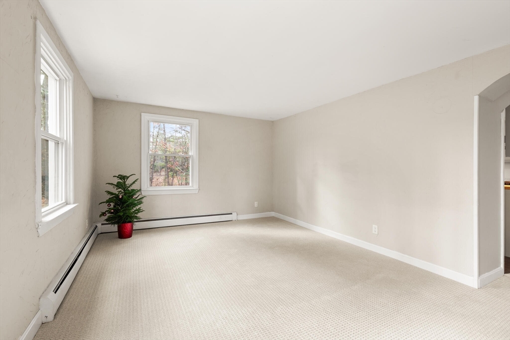 319 Pleasant Street Dunstable, MA 01827 - Photo 8 of 36 an empty room with windows