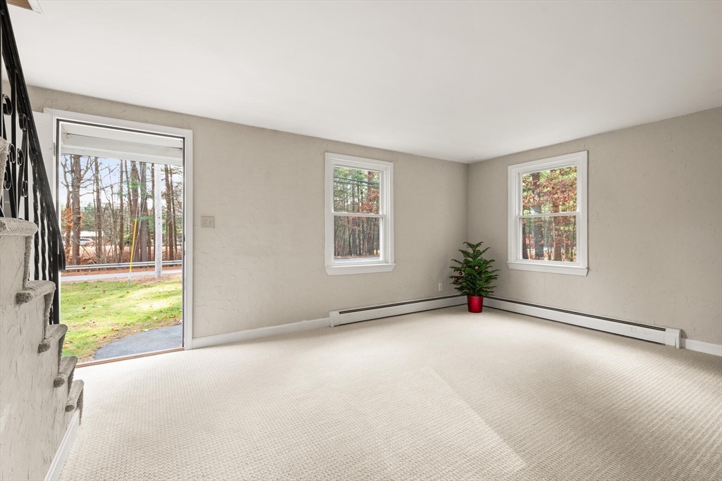 319 Pleasant Street Dunstable, MA 01827 - Photo 10 of 36 a view of an empty room with a window