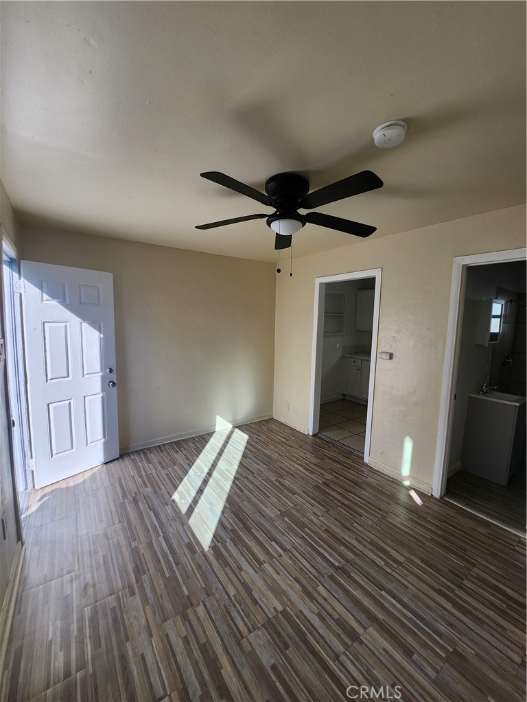 3717 West Imperial Highway, Unit 8 Inglewood, CA 90303 - Photo 6 of 7 a view of an empty room with wooden floor and a window
