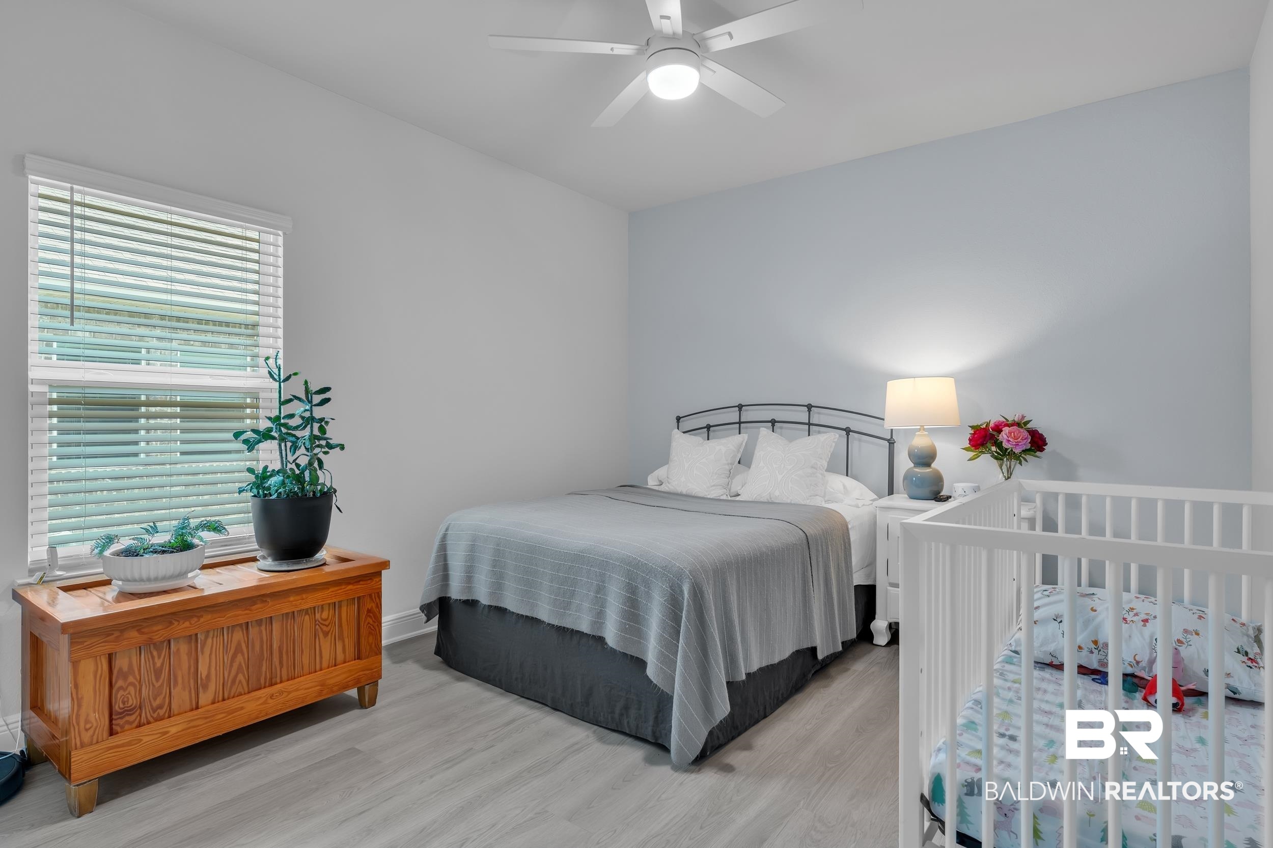 8774 Primland Boulevard Foley, AL 36535 - Photo 34 of 49 Bedroom with wood finished floors and a ceiling fan