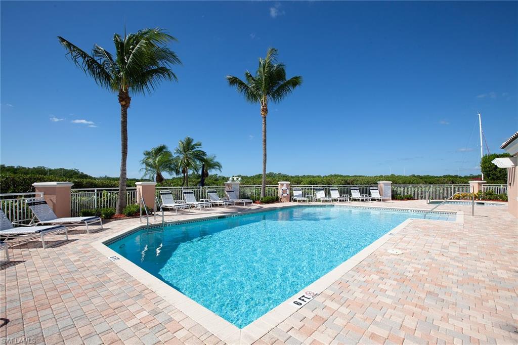 435 Dockside Drive, Unit B703 Naples, FL 34110 - Photo 30 of 38 a view of a terrace with a garden and plants