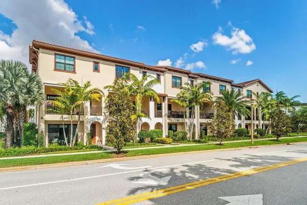a view of a building with a yard