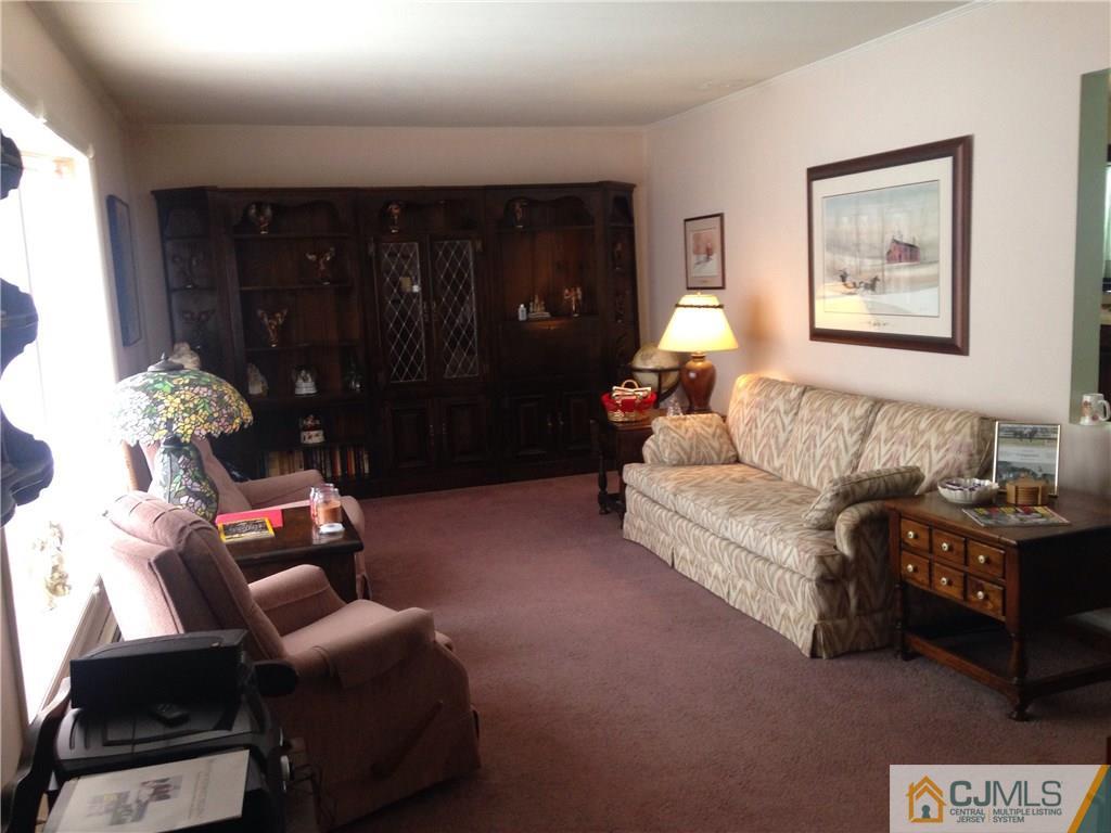 23 Williams Road Edison, NJ 08820 - Photo 11 of 21 a living room with furniture and wooden floor