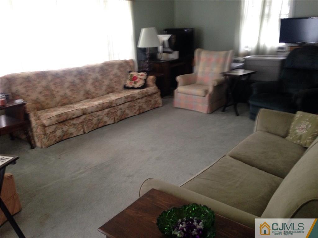 23 Williams Road Edison, NJ 08820 - Photo 13 of 21 a living room with furniture and a couch