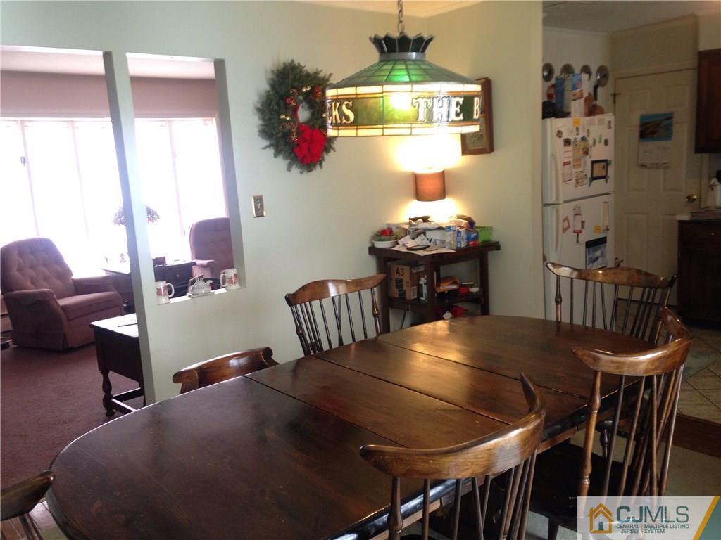 23 Williams Road Edison, NJ 08820 - Photo 15 of 21 a view of a dining room with furniture and chandelier