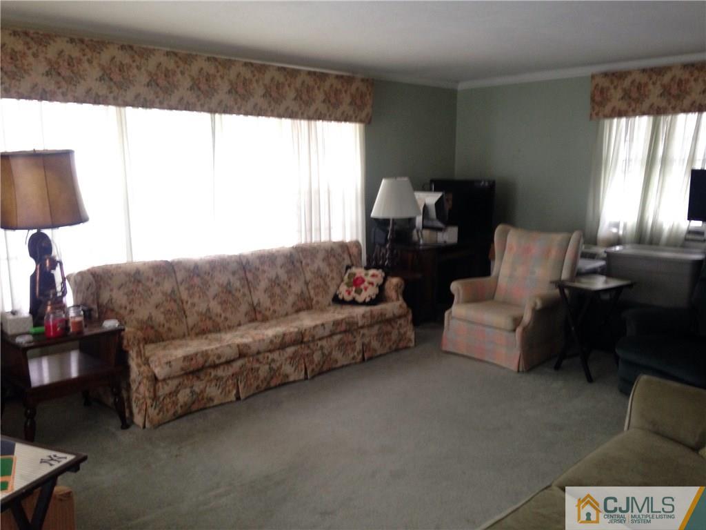 23 Williams Road Edison, NJ 08820 - Photo 16 of 21 a living room with furniture and a large window