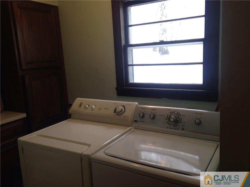 23 Williams Road Edison, NJ 08820 - Photo 17 of 21 a utility room with dryer and washer