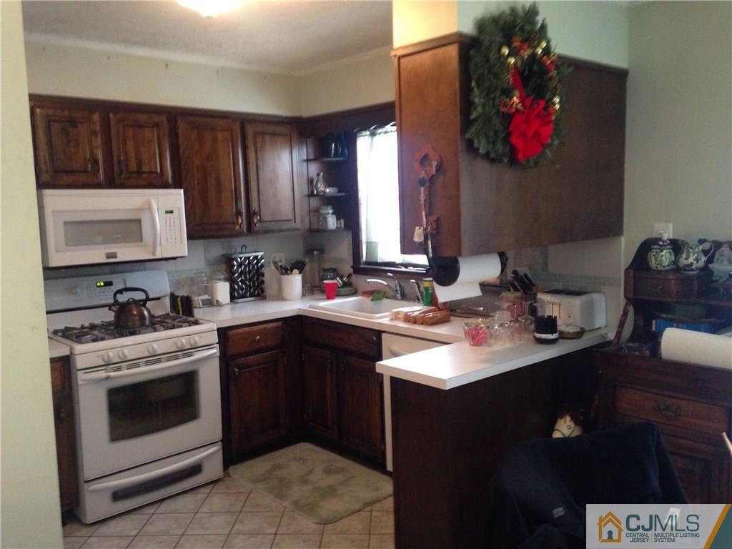 23 Williams Road Edison, NJ 08820 - Photo 19 of 21 a kitchen with a sink cabinets and wooden floor