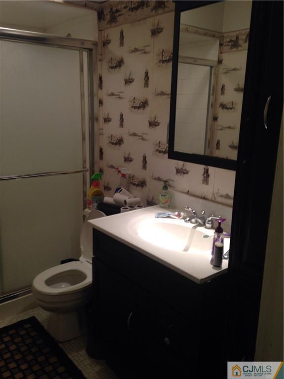 23 Williams Road Edison, NJ 08820 - Photo 5 of 21 a bathroom with a sink toilet and mirror