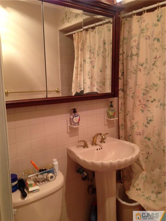 23 Williams Road Edison, NJ 08820 - Photo 7 of 21 a bathroom with a sink and mirror