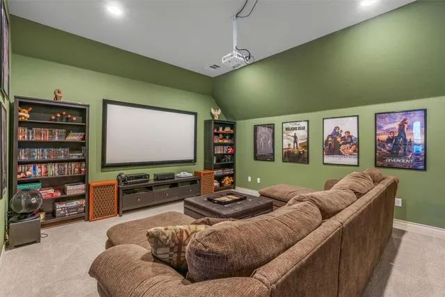 a living room with furniture and a open kitchen