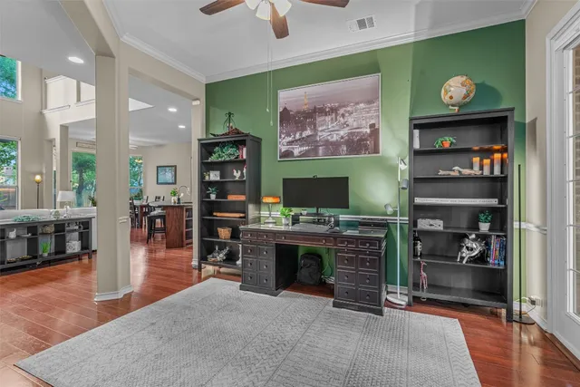 a living room with fireplace furniture and a flat screen tv