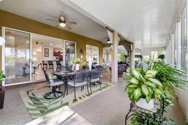 a living room with furniture a window and a table