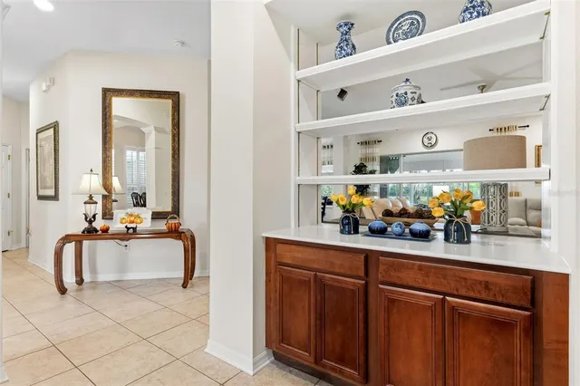a view of living room with stainless steel appliances granite countertop lots of counter top space