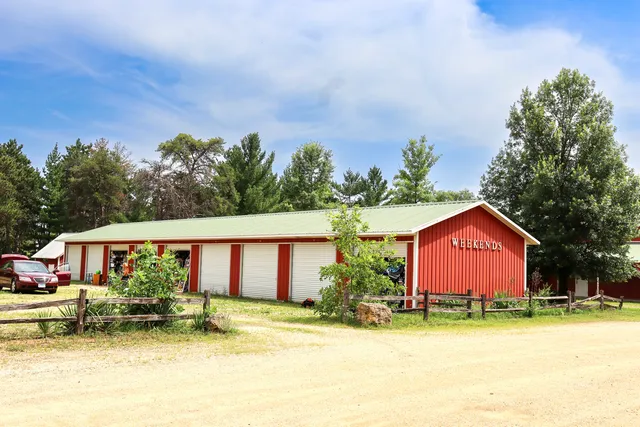 a view of a house with swimming pool and a yard
