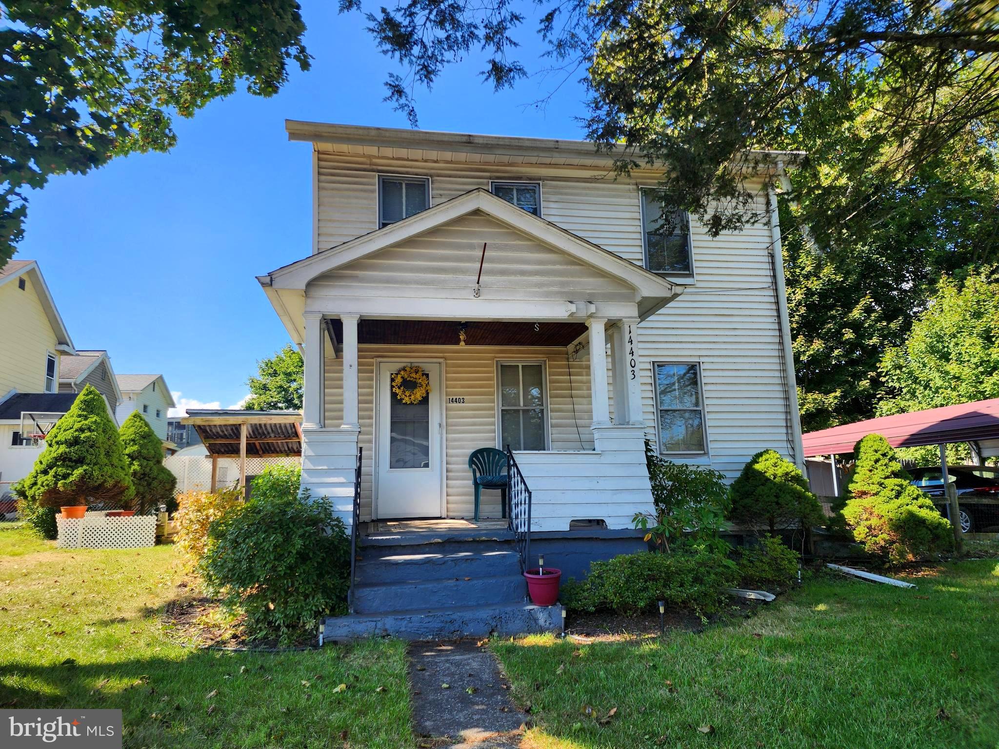 14403 Ellerslie Road Ellerslie, MD 21529 - Photo 13 of 34 a front view of a house with garden