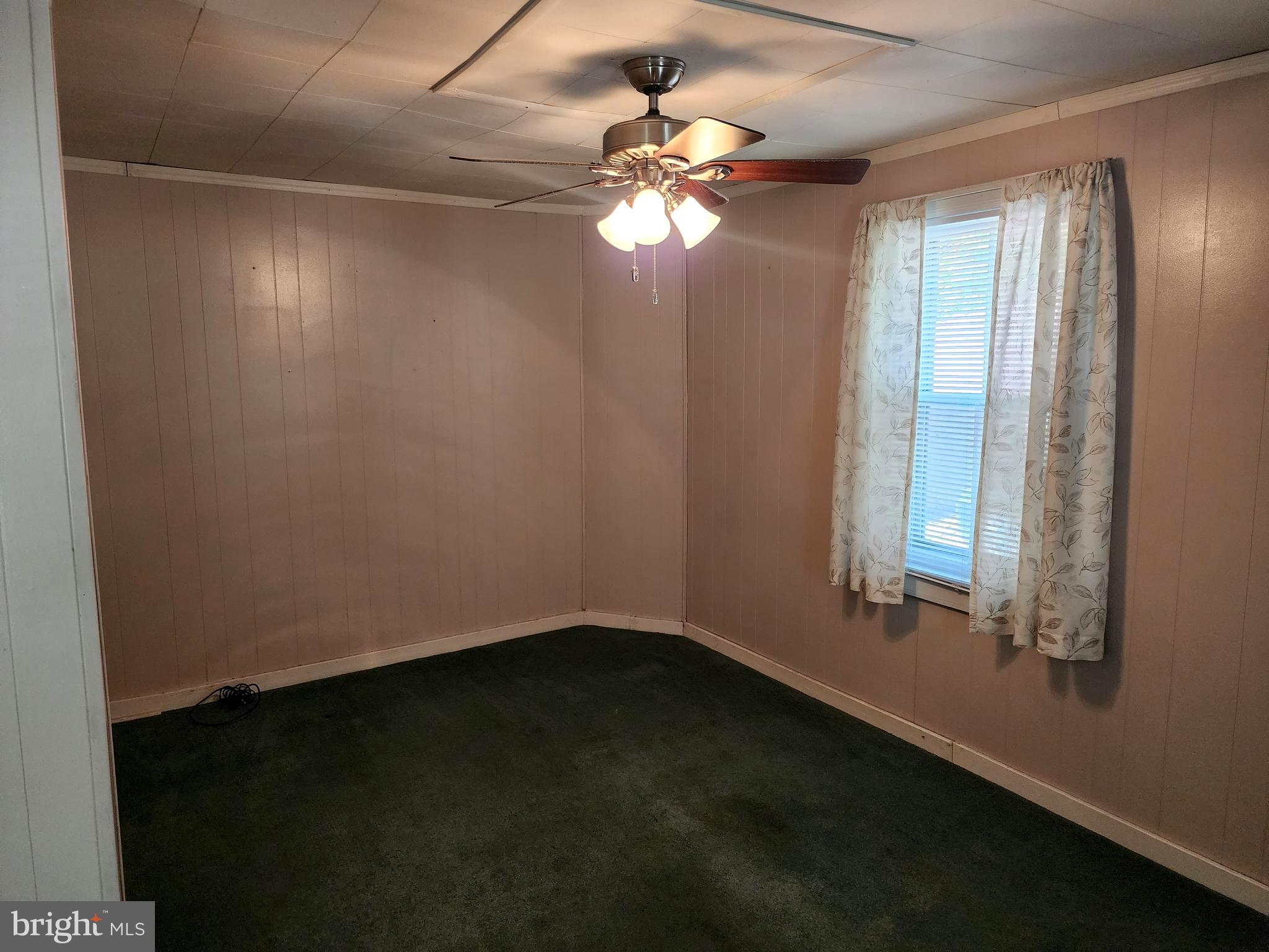 14403 Ellerslie Road Ellerslie, MD 21529 - Photo 18 of 34 wooden floor in an empty room with a window