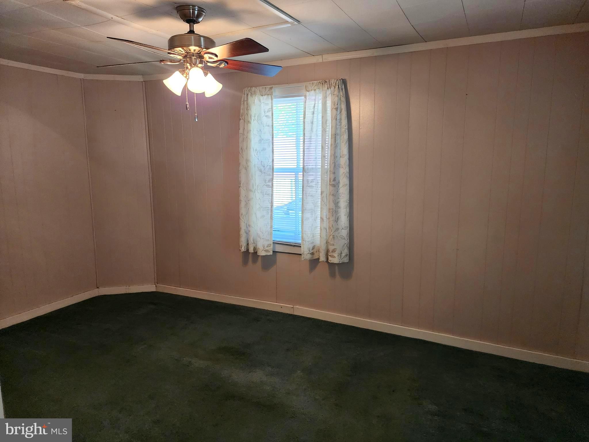 14403 Ellerslie Road Ellerslie, MD 21529 - Photo 19 of 34 an empty room with windows and fan