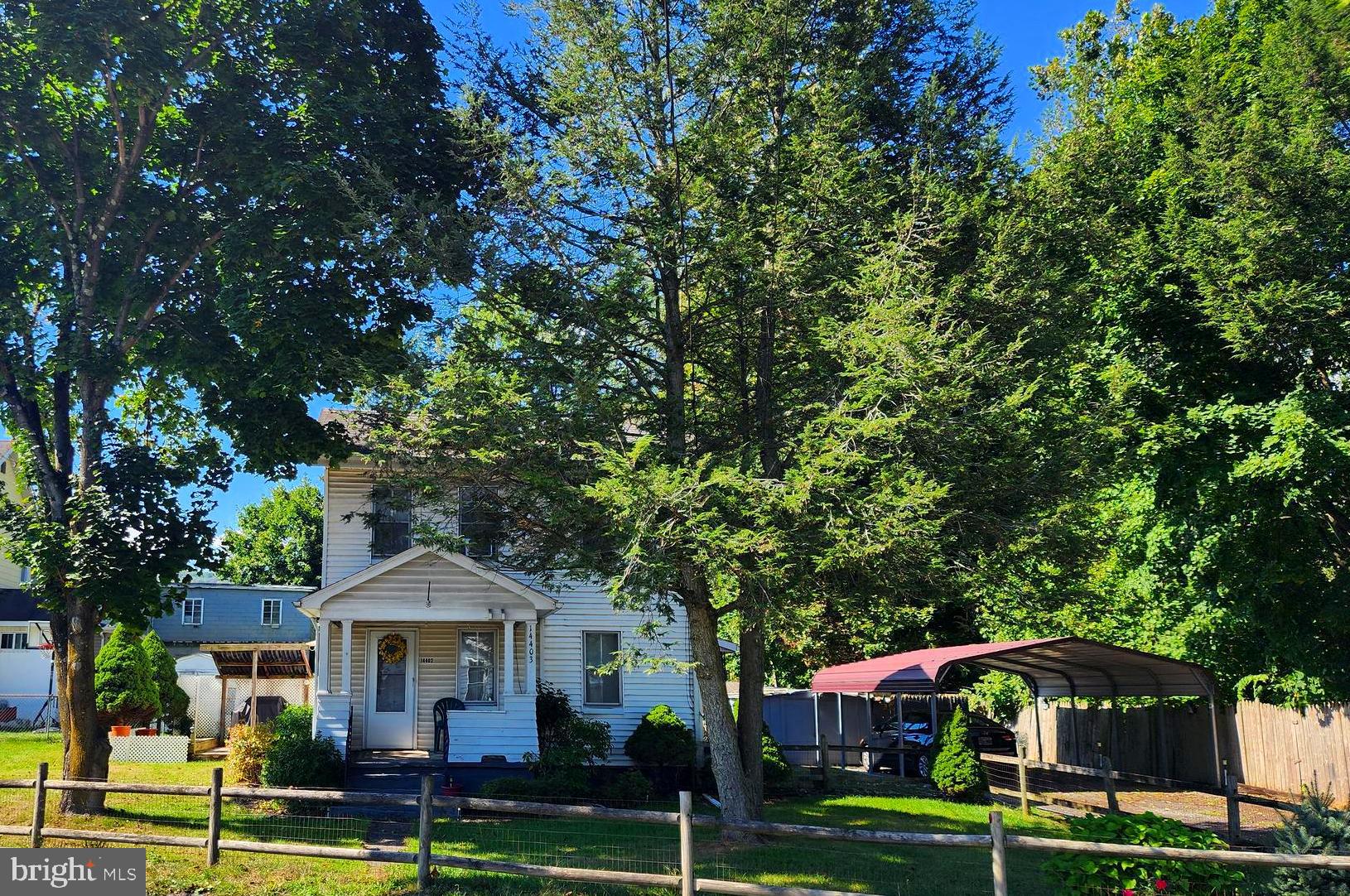 14403 Ellerslie Road Ellerslie, MD 21529 - Photo 6 of 34 a front view of a house with a yard