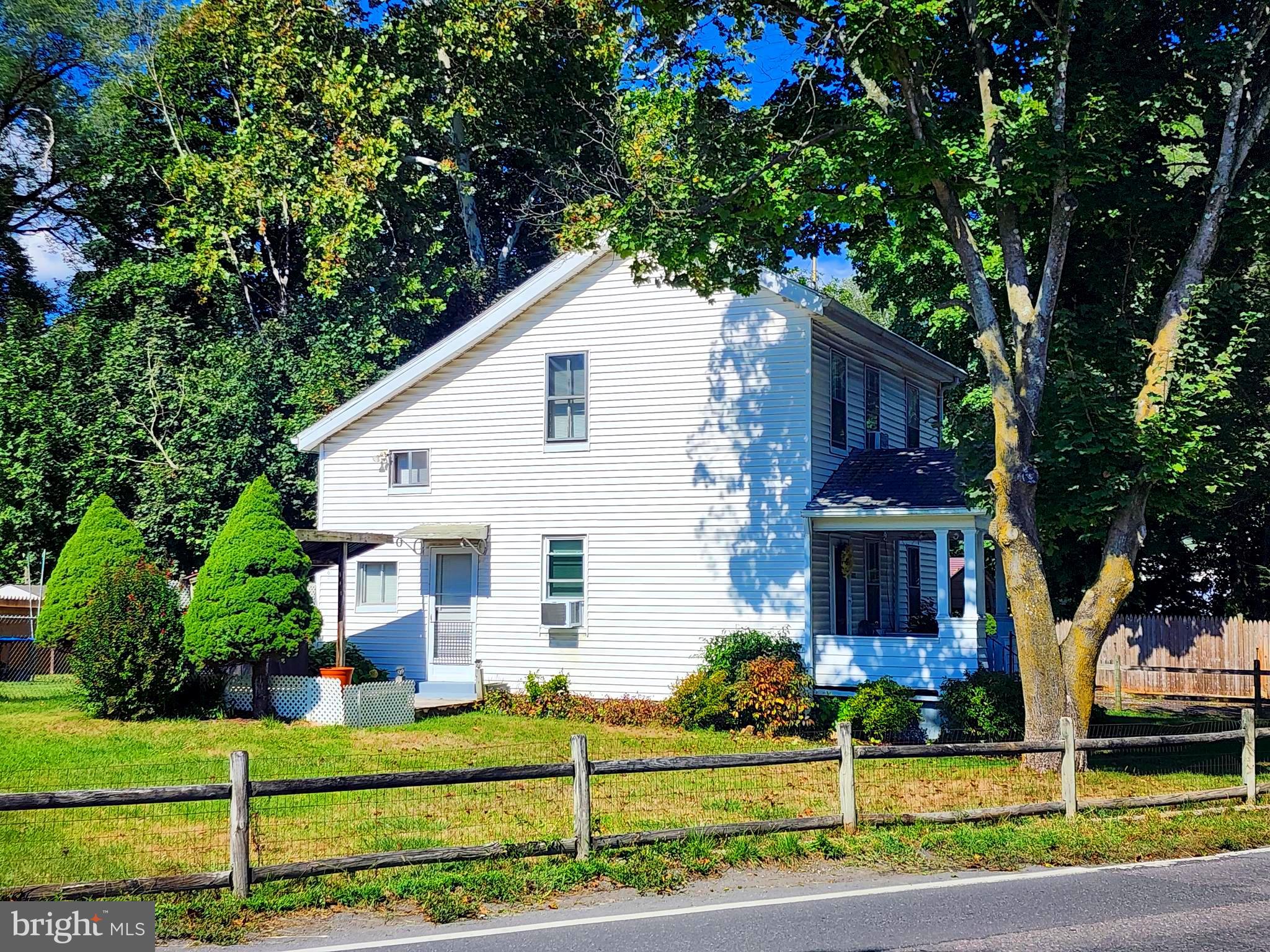 14403 Ellerslie Road Ellerslie, MD 21529 - Photo 8 of 34 a front view of a house with a yard