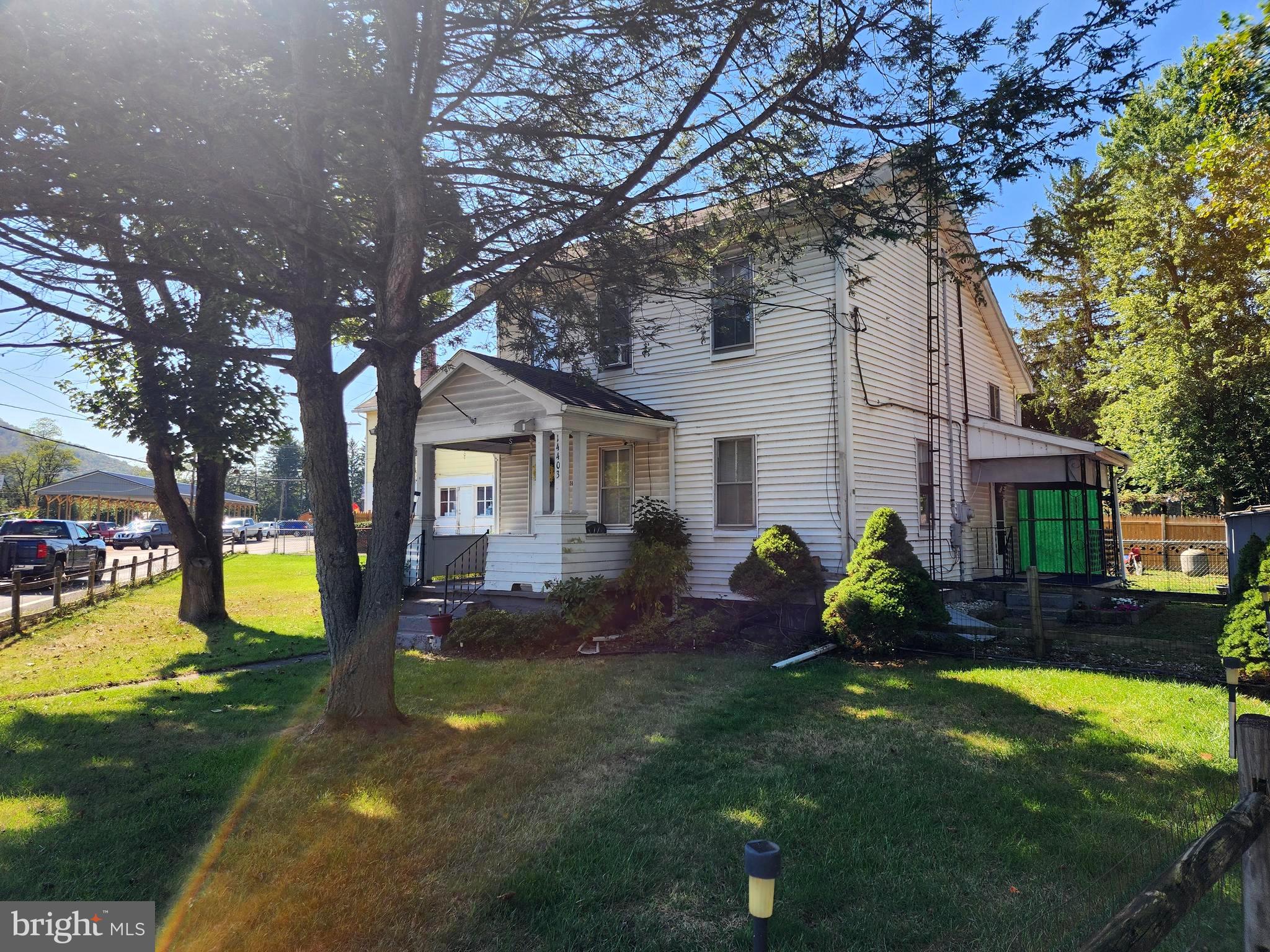 14403 Ellerslie Road Ellerslie, MD 21529 - Photo 9 of 34 a front view of a house with garden