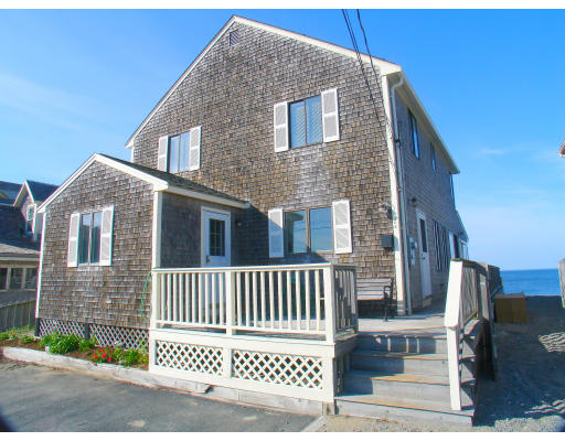 a view of a house with wooden fence