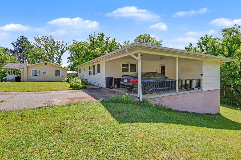 63 Fort Butler Street Murphy, NC 28906 - Photo 3 of 30 a view of house with a yard and potted plants