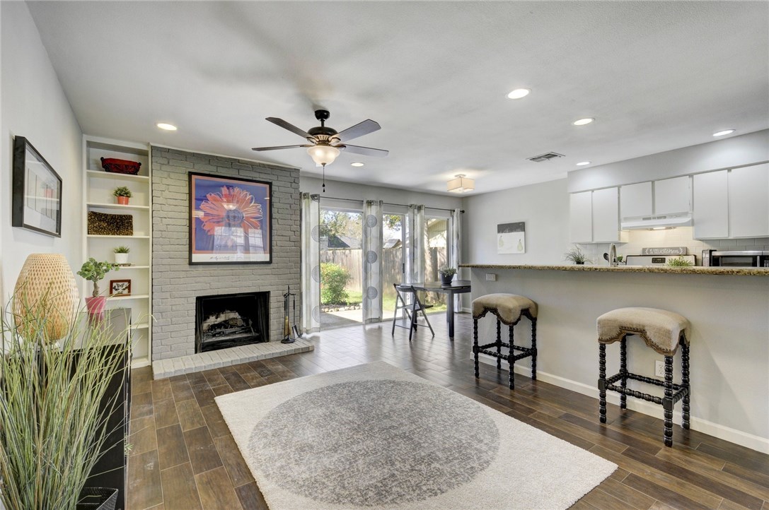 12314 Double Tree Lane Austin, TX 78750 - Photo 1 of 1 a living room with furniture and a fireplace