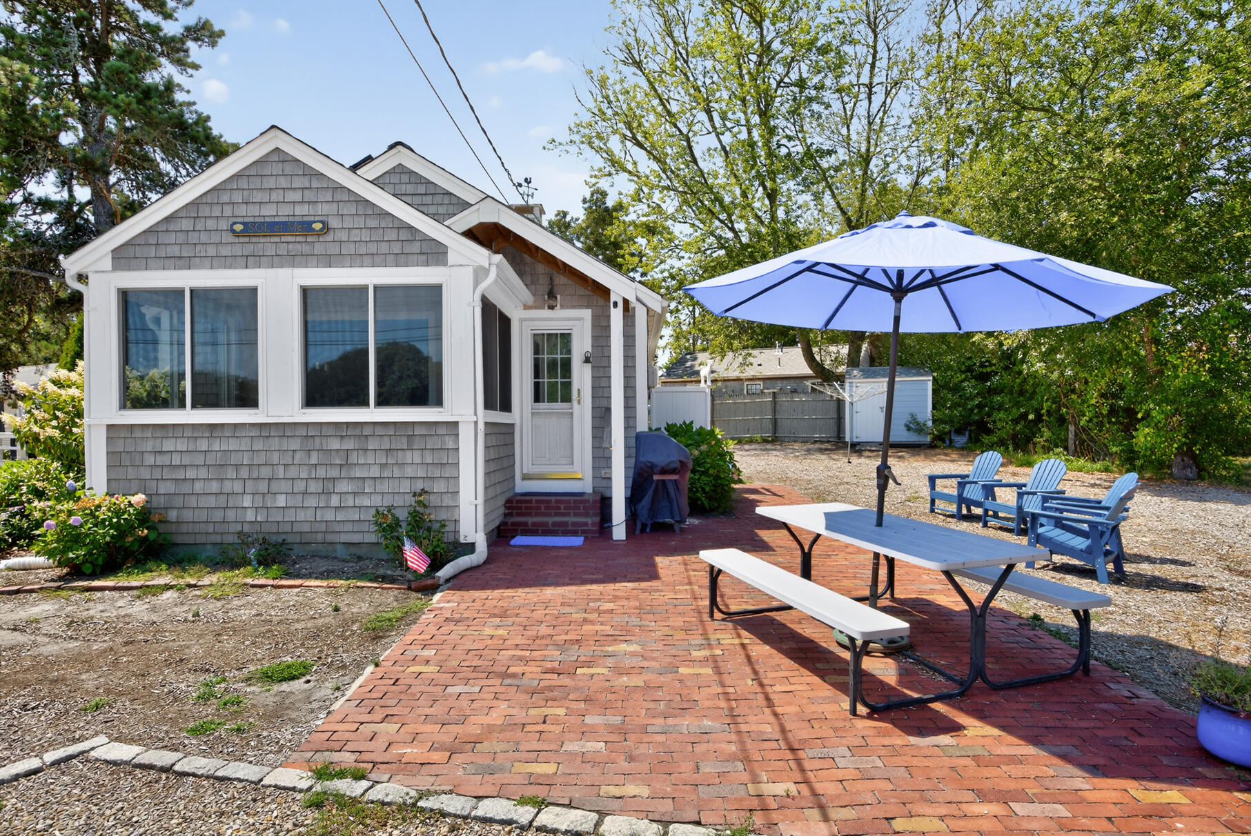 13 Garden Lane Dennis Port, MA 02639 - Photo 29 of 43 a view of a house with backyard sitting area and garden