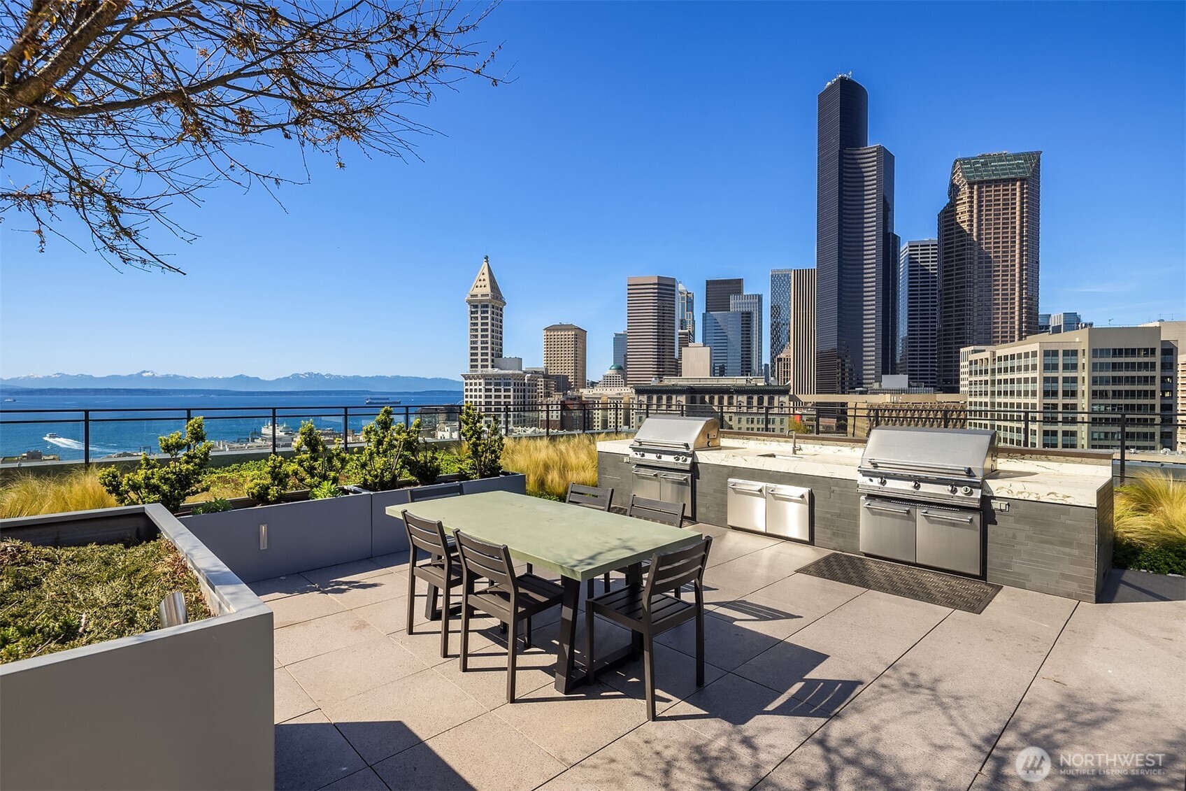 450 South Main Street, Unit 618 Seattle, WA 98104 - Photo 17 of 40 a dinning table and chairs in the terrace