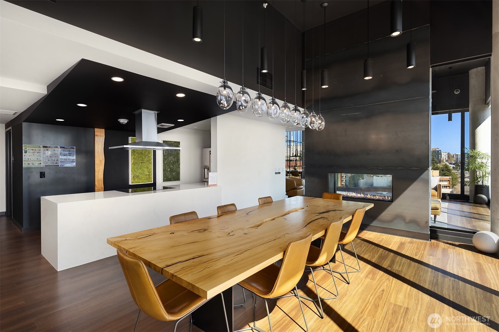 450 South Main Street, Unit 618 Seattle, WA 98104 - Photo 29 of 40 a dinning table and chairs in a kitchen