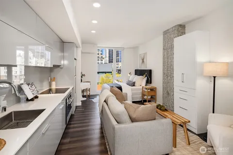 a living room with furniture and a rug
