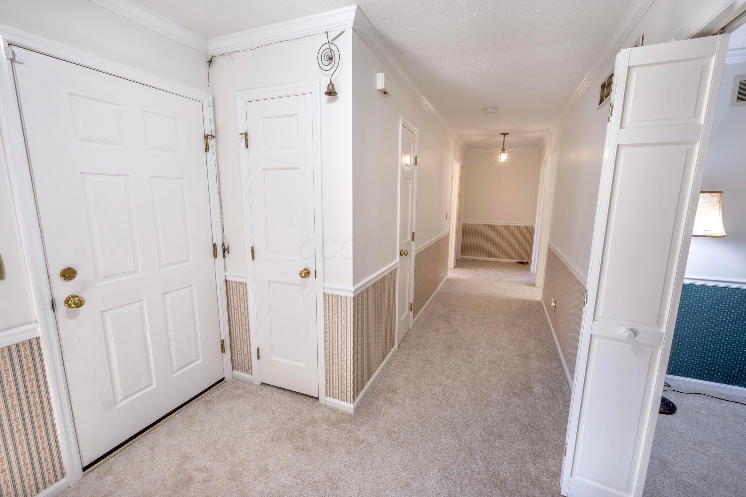 3880 Fry Road Ostrander, OH 43061 - Photo 36 of 82 Coat closet and a look down the bedroom wing.