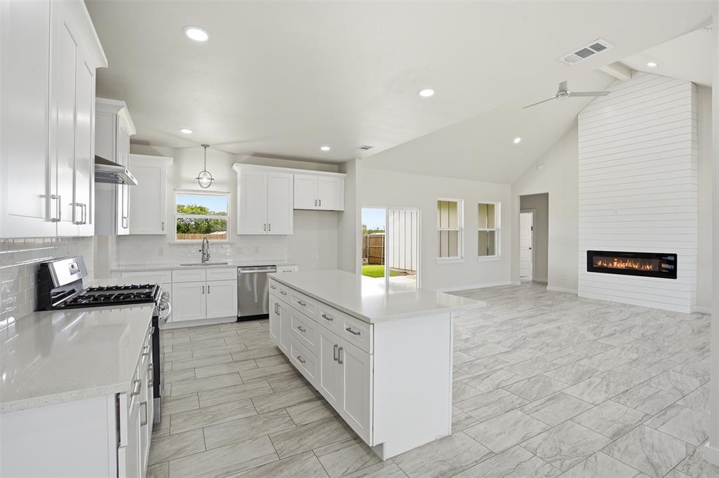 532 Highview Court Godley, TX 76044 - Photo 20 of 39 Open-concept living space featuring a contemporary kitchen and living area