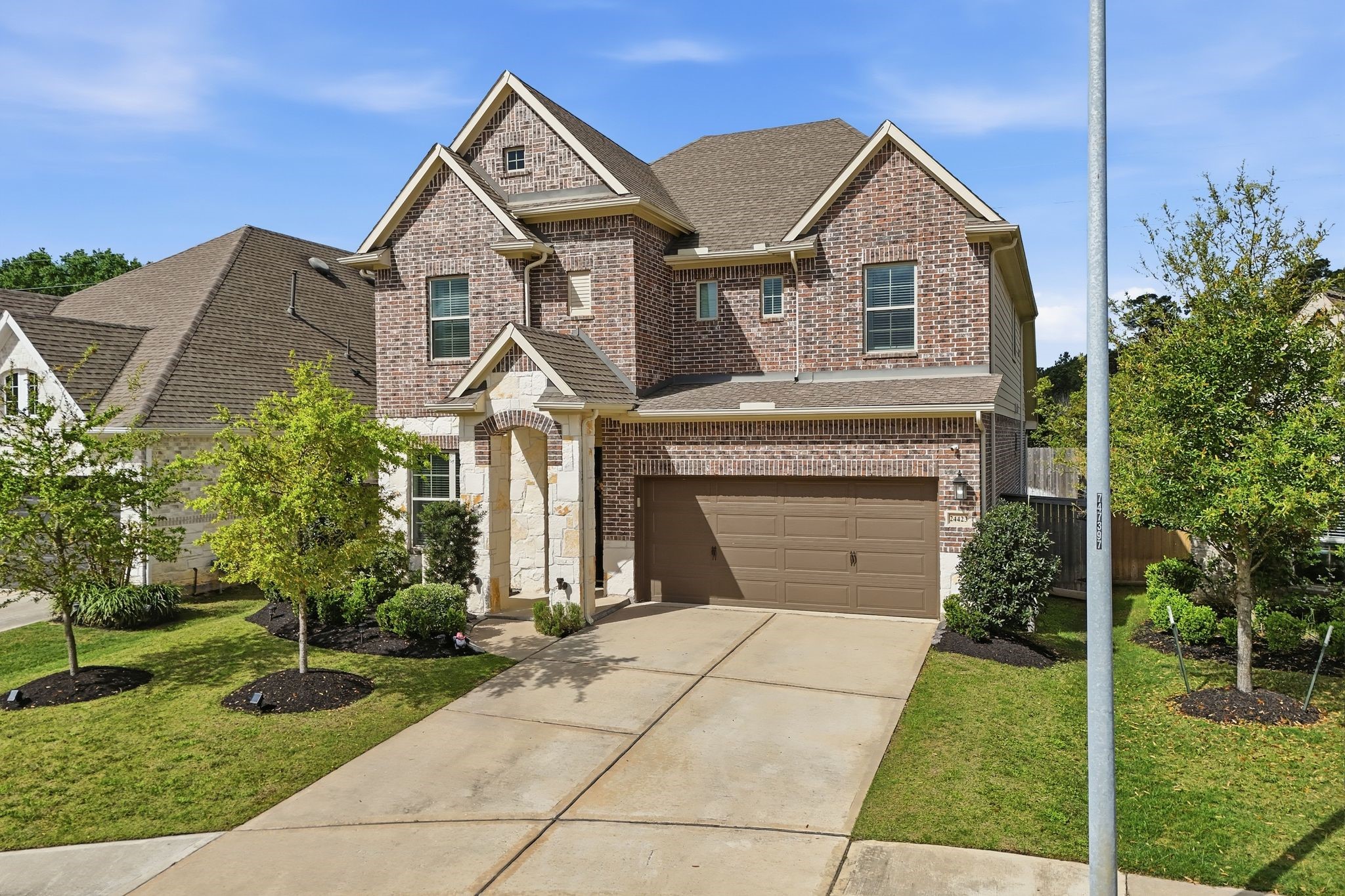 24423 Morningside Terrace Tomball, TX 77375 - Photo 1 of 47 a front view of a house with garden