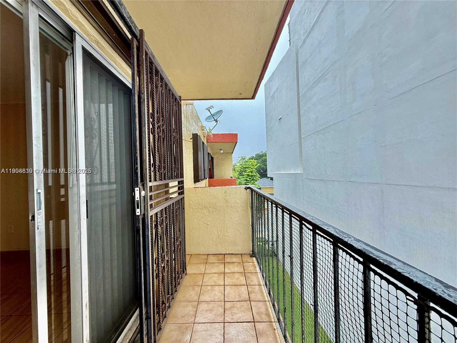 424 Southwest 7th Street, Unit 404 Miami, FL 33130 - Photo 9 of 10 a view of a house with wooden floor