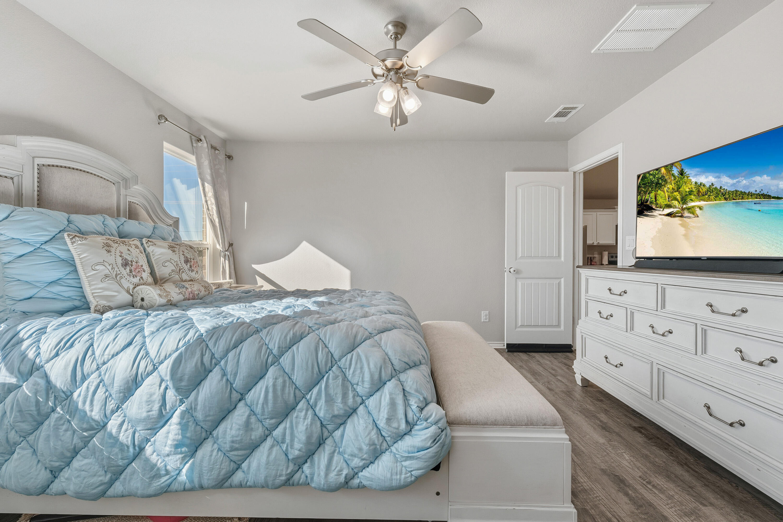 6827 39th Street Lubbock, TX 79407 - Photo 14 of 25 a bedroom with a bed and a dresser
