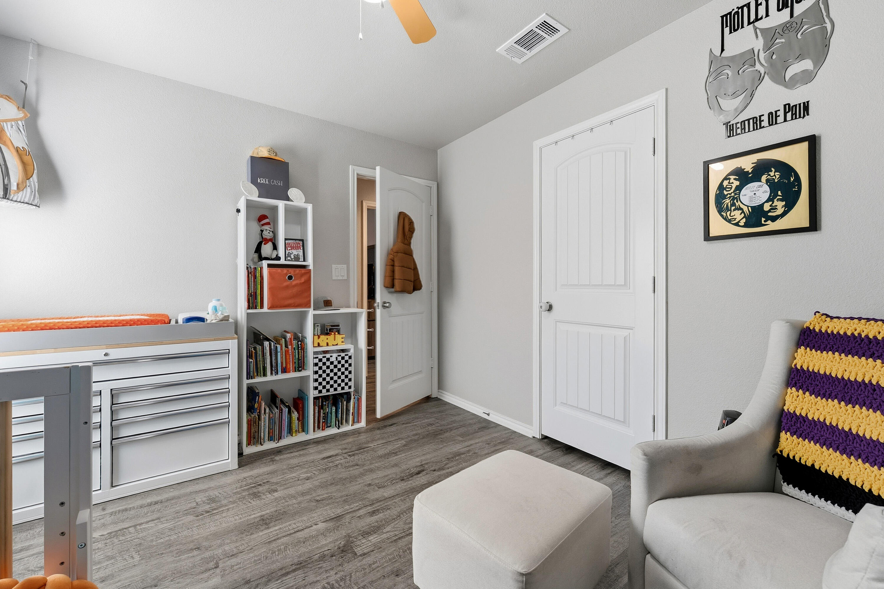 6827 39th Street Lubbock, TX 79407 - Photo 20 of 25 a living room with furniture and a flat screen tv