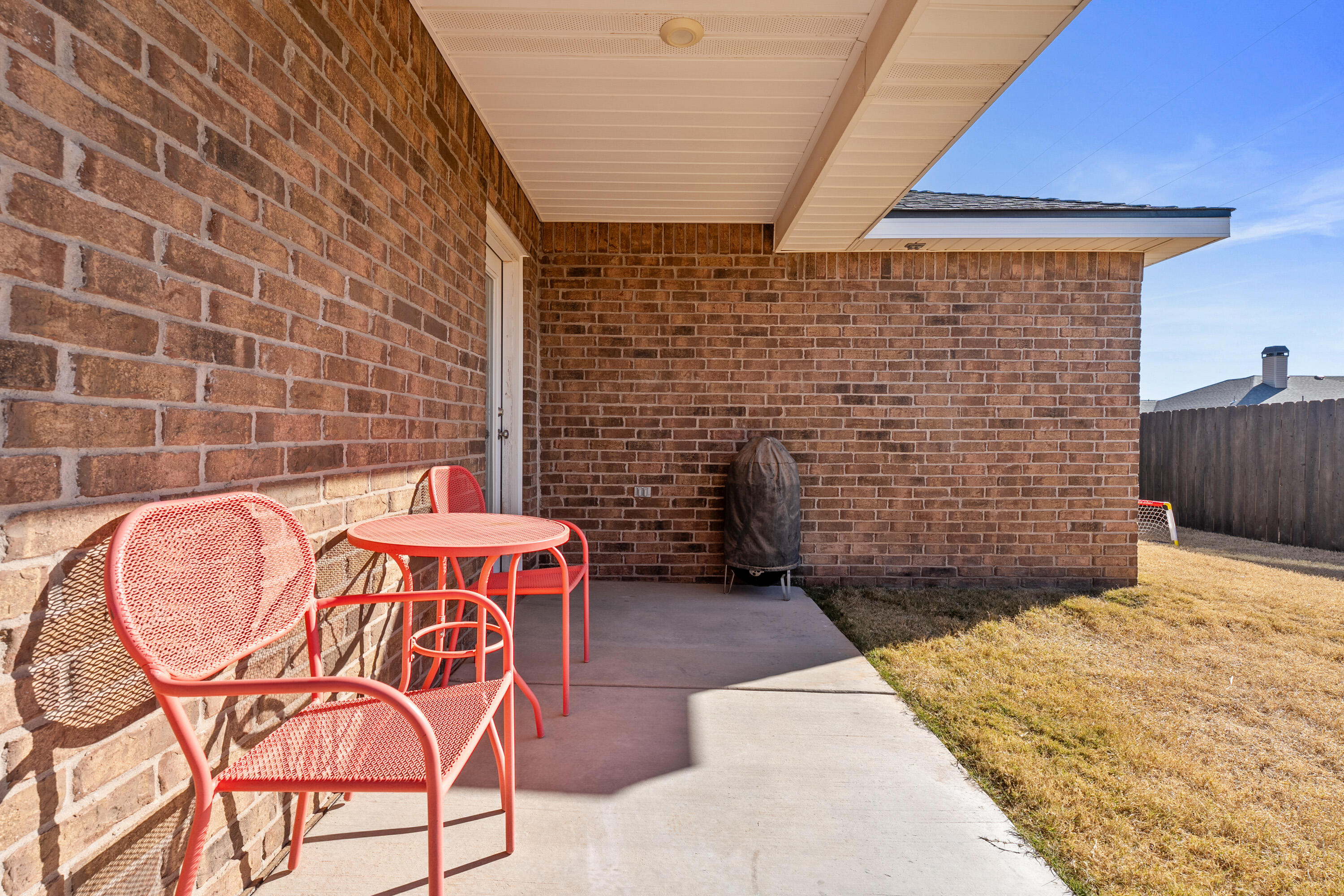 6827 39th Street Lubbock, TX 79407 - Photo 23 of 25 a backyard of a house with barbeque oven
