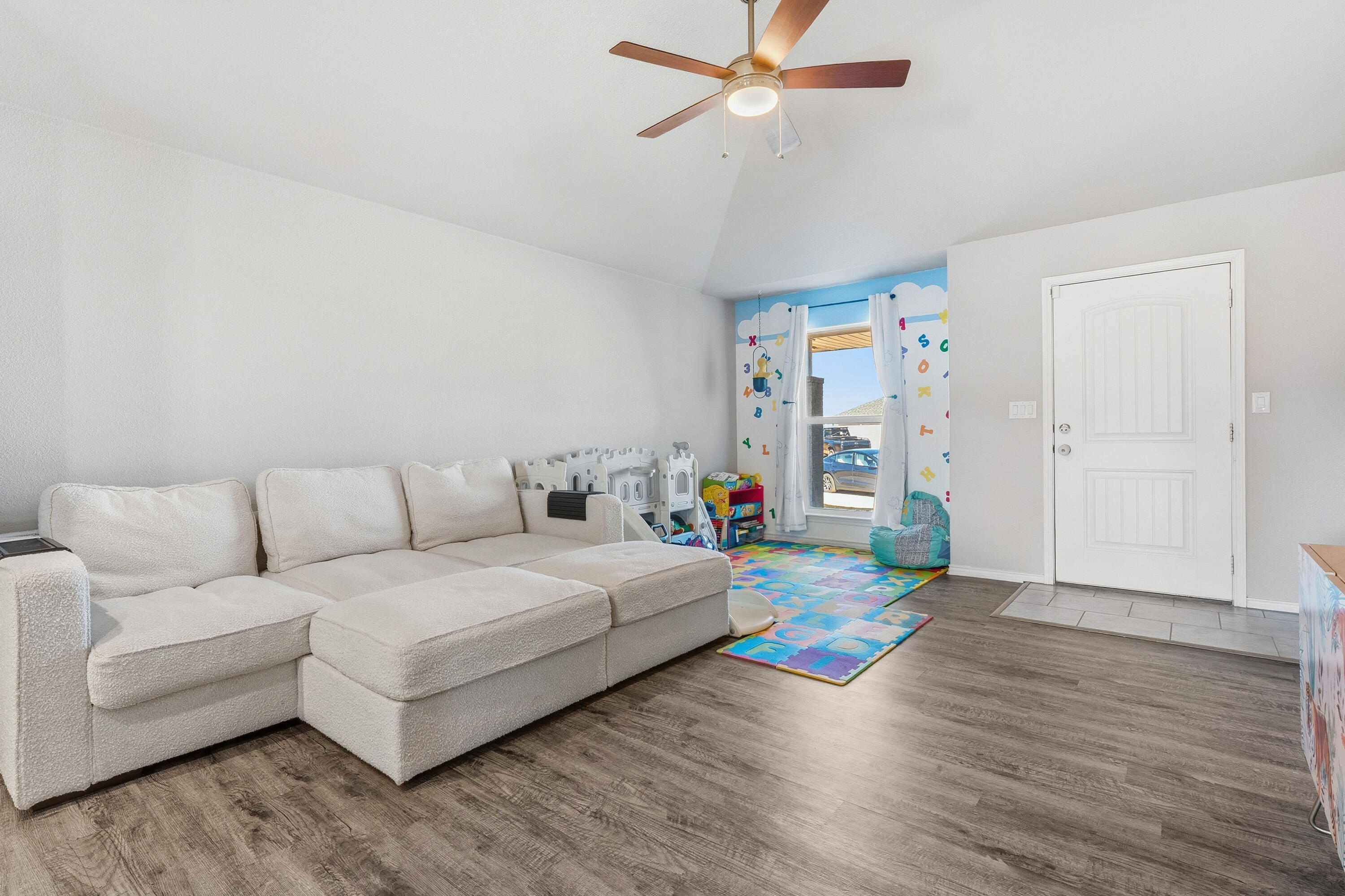 6827 39th Street Lubbock, TX 79407 - Photo 8 of 25 a living room with furniture and a large window