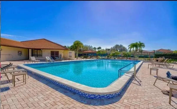 a view of a backyard with sitting area