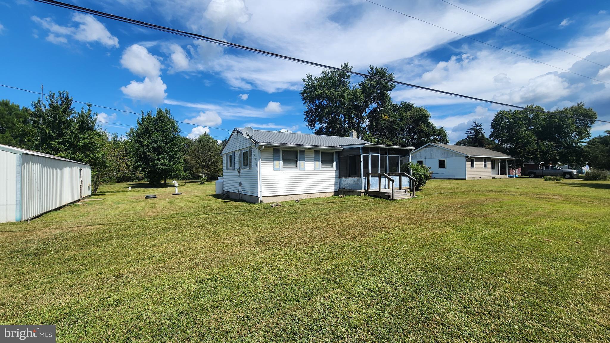 6289 Mud Mill Road Camden Wyoming, DE 19934 - Photo 3 of 10 a view of a house with a backyard and a tree