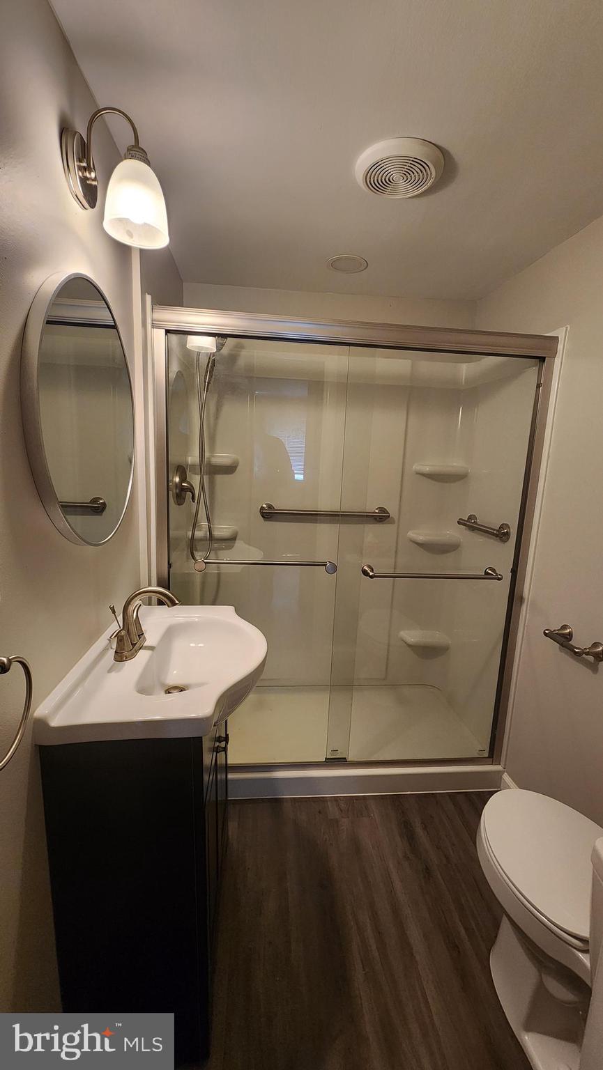 6289 Mud Mill Road Camden Wyoming, DE 19934 - Photo 7 of 10 a bathroom with a sink mirror vanity and toilet