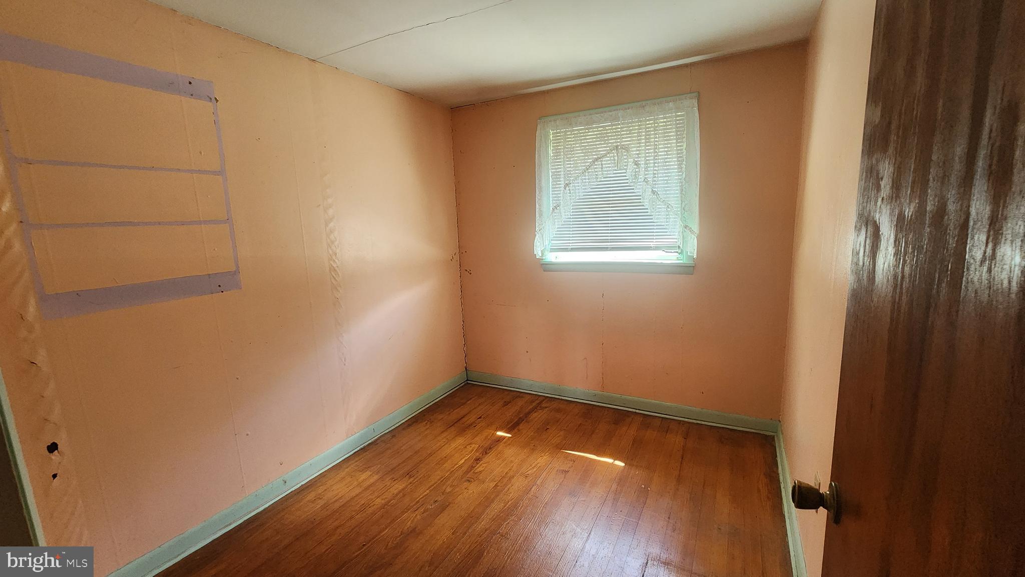 6289 Mud Mill Road Camden Wyoming, DE 19934 - Photo 8 of 10 a view of a room with wooden floor and small window
