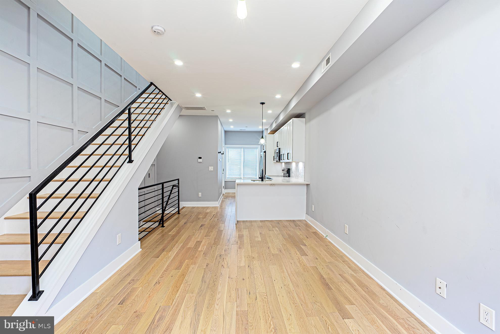 1219 Wylie Street Northeast, Unit 2 Washington, DC 20002 - Photo 7 of 29 a view of a hallway with wooden floor