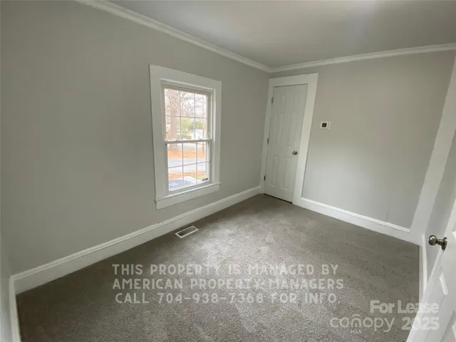 a view of a room that has a window in it