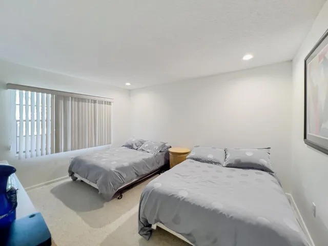 a spacious bathroom with a double vanity sink mirror and toilet