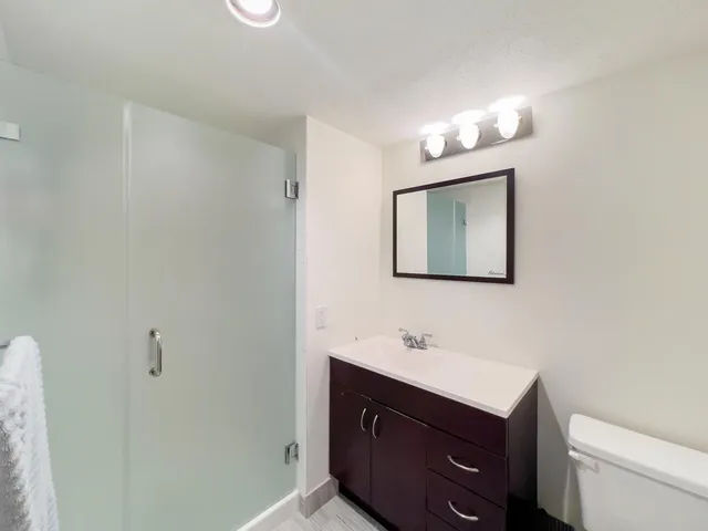 a bedroom with two beds and a window