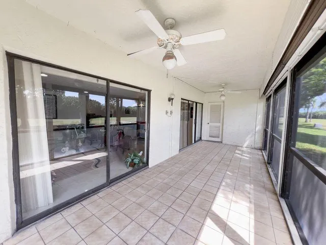 a view of an empty room with a large window